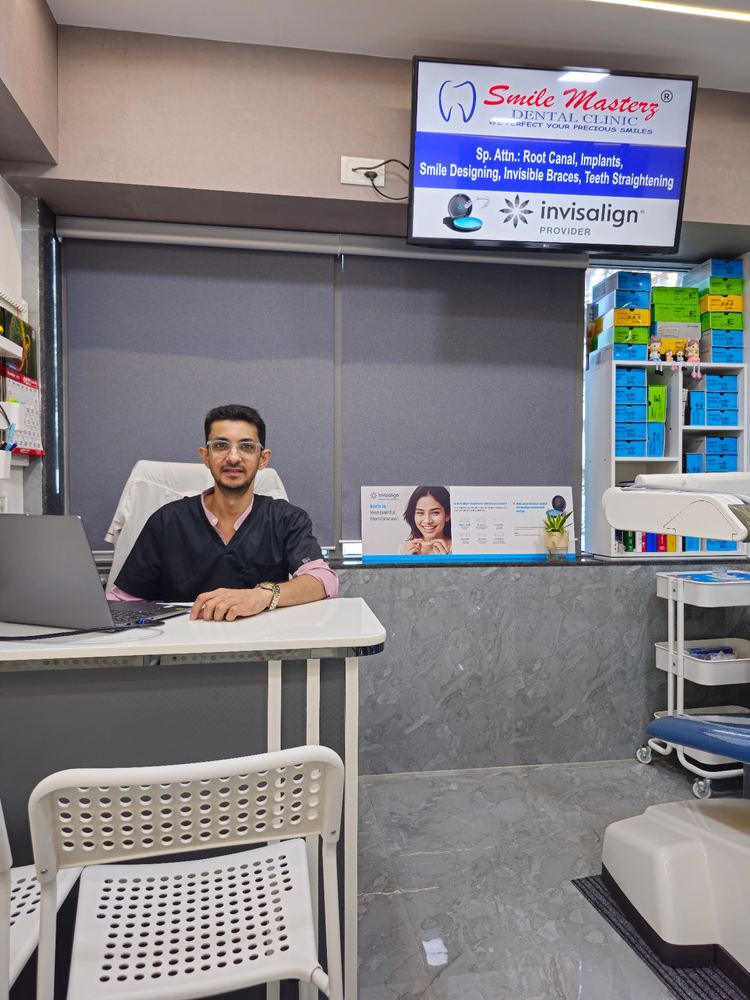Dentist seated at the consultation desk in the clinic